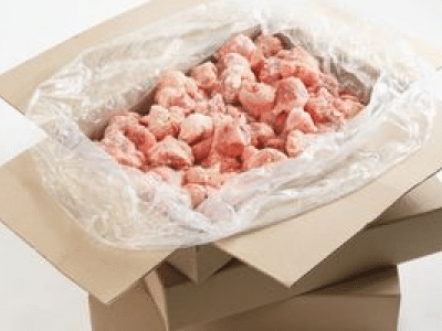 Raw pieces of chicken in bulk packaging